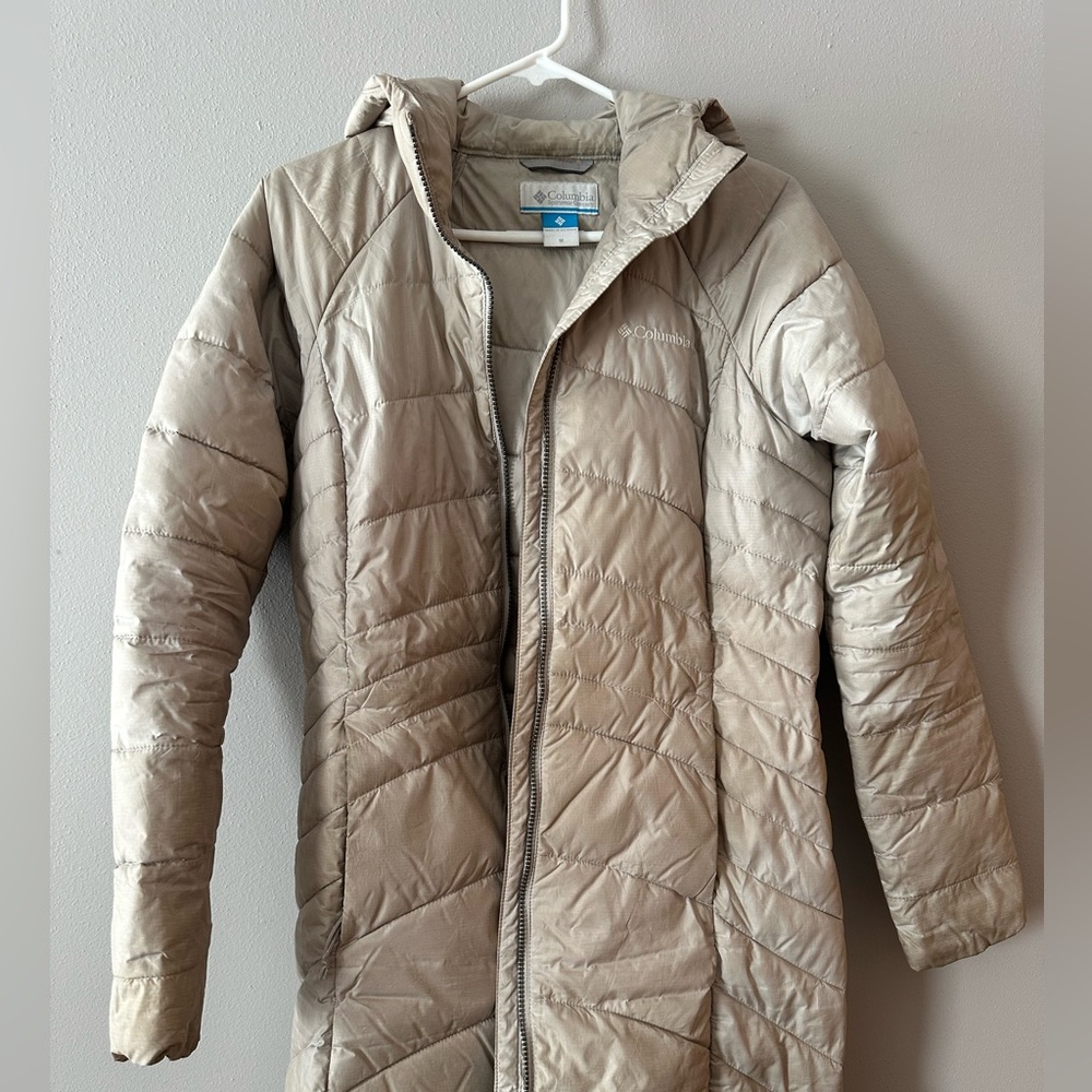 Columbia upper thigh long beige winter jacket.